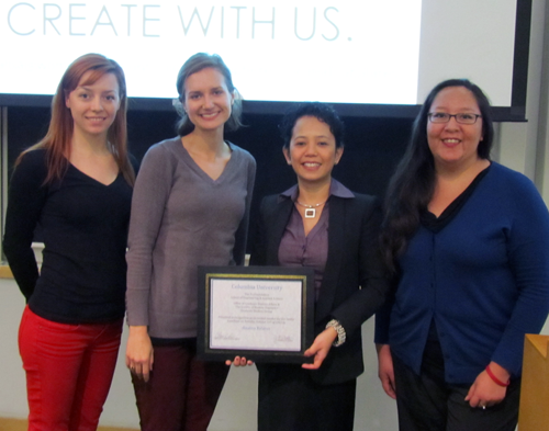 4 Women standing in a row facing the camera. Caption has their names.