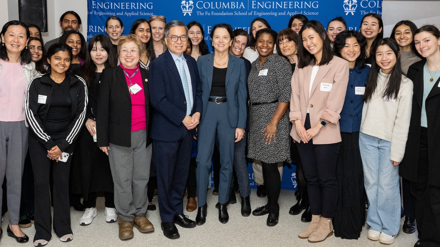 20-plus members of the Columbia Chapter of the Society of Women Engineers pose for a photo with Dean Shih-Fu Chang