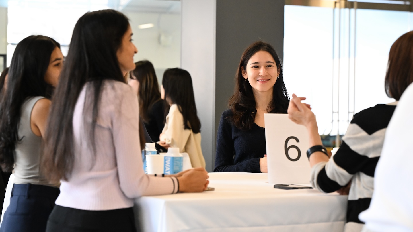 Women conversing at a table at The “Celebrating and Networking with Columbia University's Women in STEM” event