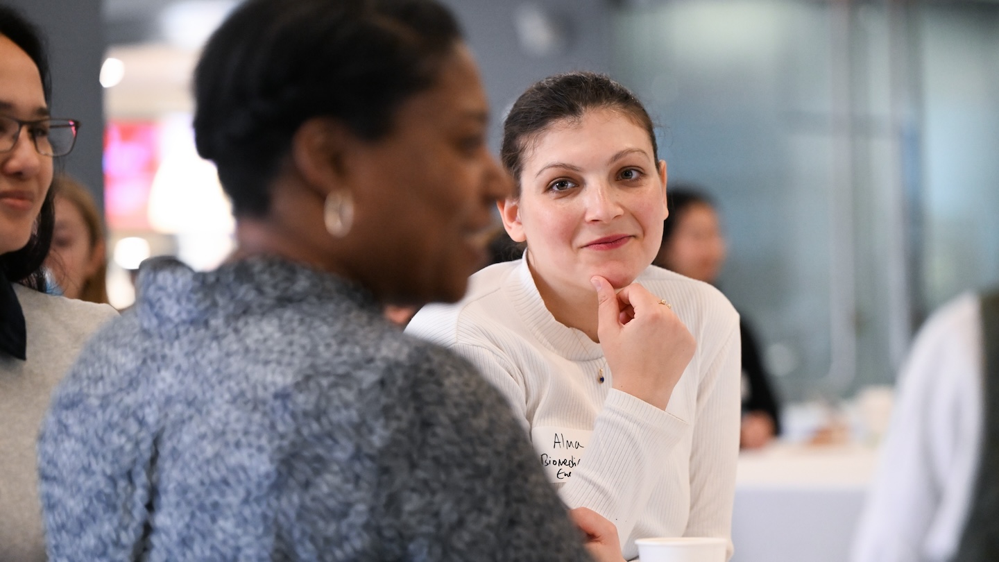 Women conversing at a table
