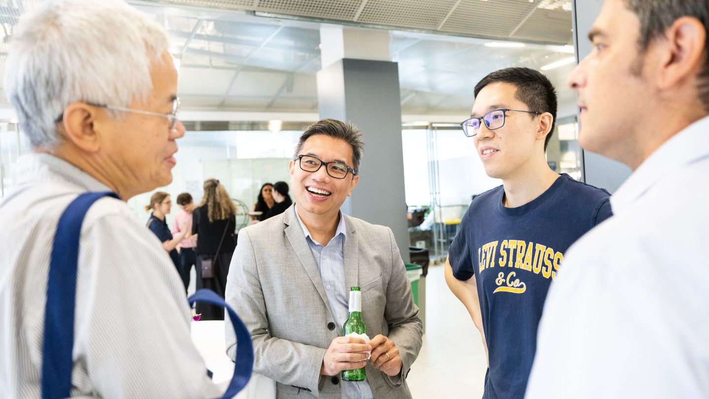 Four faculty members gather in conversation at the Welcome Back Faculty and Honors event.